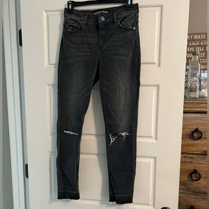 Express black stretch skinny jeans with slits in knees